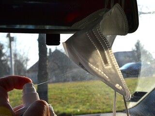 Improvised disinfection of FFP2 class respirator with alcohol spray disinfectant. Respirator is...