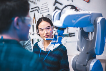 Meeting asian Engineers Maintenance Robot Arm at Lab. they are in a High Tech Research Laboratory...