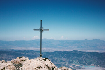 cross on top of a mountain