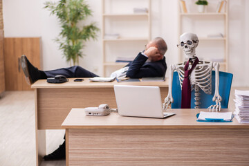 Dead employee working in the office