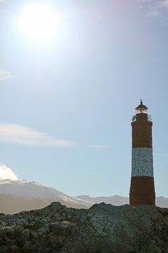 Bright Sun Shining over Les Eclaireurs lighthouse on a rocky islands in Beagle channel, Ushuaia, Patagonia, Argentina
