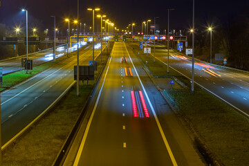 Fototapeta na wymiar Highway at night next to Ghent