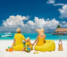 Family with three year old boy on beach