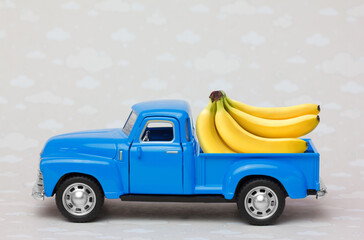 Toy Truck delivering  bananas. Banana supply concept