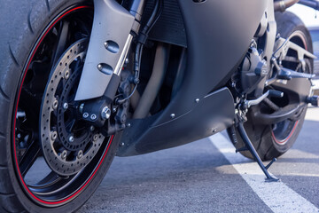 close up of a motorcycle, wheel of a motorcycle