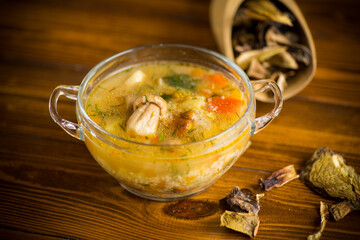 vegetarian vegetable soup with porcini mushrooms in a glass bowl