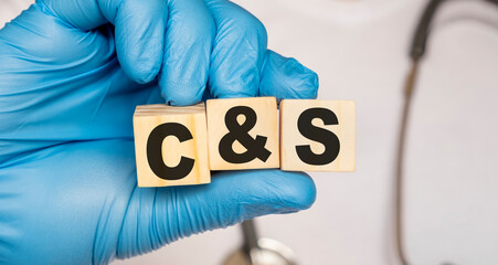 CS Culture and sensitivity, performed to detect infection - word from wooden blocks with letters...