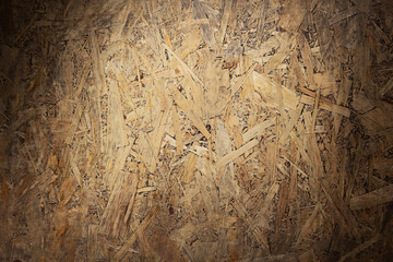 Aged osb wooden background of table or wall texture. Chipboard wood background