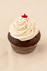 Chocolate muffin cake with light cream, close up