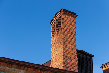 Old chimneys on the roof of a building in St. Petersburg.