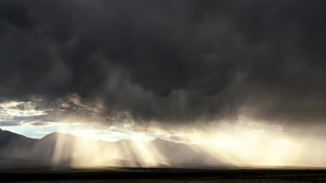 Dramatic timelapse of dark clouds and sunbeams in Colorado