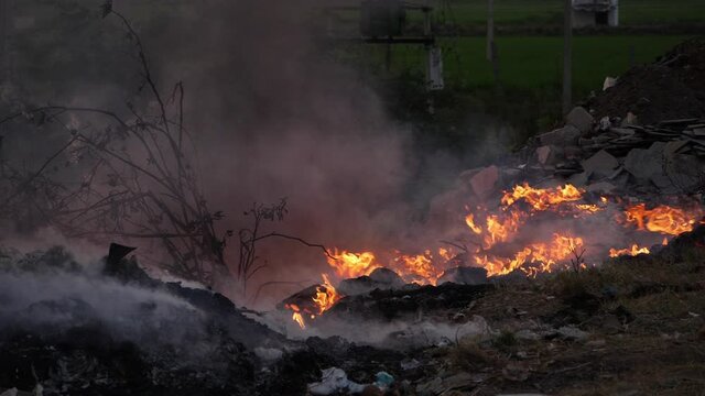 Close shot of burning waste causing air pollution