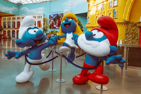 MOSCOW, RUSSIA - MARCH 3 2021: Funny blue smurfs family character model from the smurfs cartoon serie greets visitors in Dream Island Ostrov Mechty first indoor amusement theme park in Moscow Russia