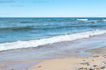 Seascape of the Lake Baikal. Waves with froth coming to the shore. Lifestyle.