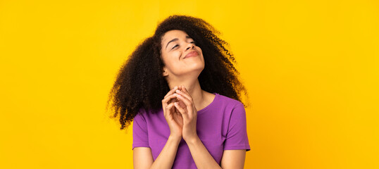 Young african american woman over isolated background scheming something