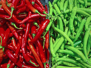 Full Frame Background of Two Halves of Red and Green Chilies for Sale