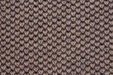 Fototapeta premium Close-up texture of a knitted fabric of a factory-made