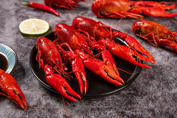 Boiled red crawfish or crayfish in plate on table