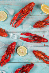 Boiled red crawfish or crayfish on wooden background