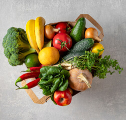 Eco-friendly paper bag on gray concrete