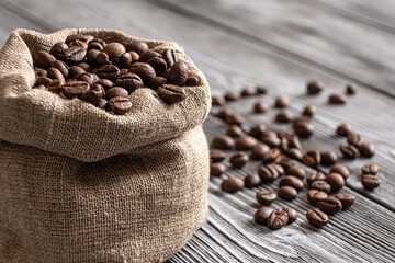 Coffee beans close-up. Coffee in a canvas bag for festive decoration. In anticipation of a fragrant drink.