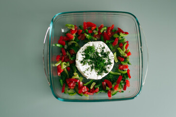 Vegetables with cheese. Vegetables with camembert cheese. Salad with soft cheese.