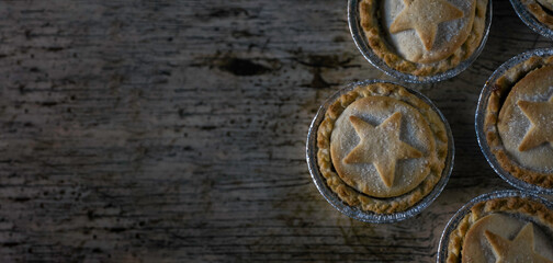 Flat Lay of British Mince Pies on Wooden Texture Background With Copy Space