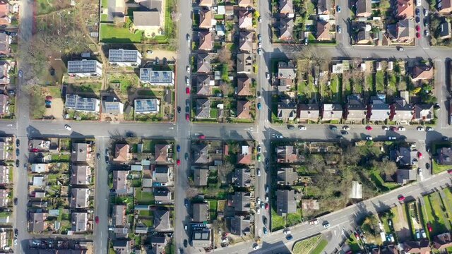 Straight down aerial footage of the town of Kirkstall in Leeds West Yorkshire in the UK, showing a drone view of the suburban houses and neighbourhood from above.