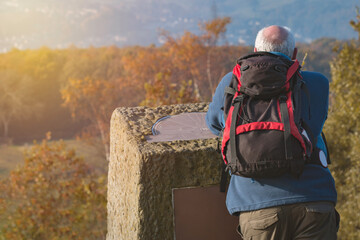 An Active Male Hiker or Explorer Looking at the far View from a High Location going on an Adventure or Journey