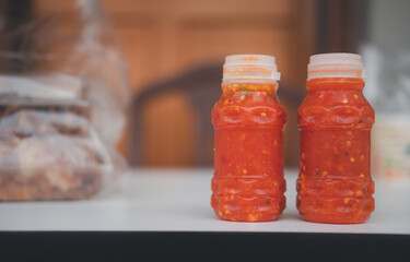 Spicy red hot sauce in plastic bottle for Sukiyaki or hot pot.