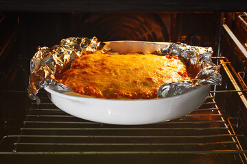 lasagna is cooked in the oven