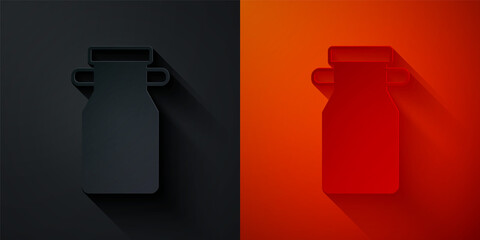 Paper cut Can container for milk icon isolated on black and red background. Paper art style. Vector