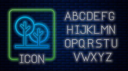 Glowing neon Tree icon isolated on brick wall background. Forest symbol. Neon light alphabet. Vector