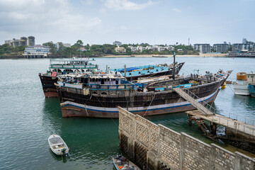 Fototapeta na wymiar Original boats for the transport of African slaves in the port of Momasa, Kenya, Africa
