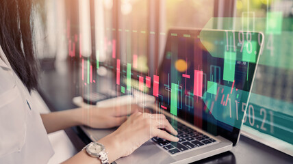 Businesswoman trader using laptop computer technology data analysis graph on forex foreign stock market exchange trading currency stock funds, casual outdoor traveling, double exposure background