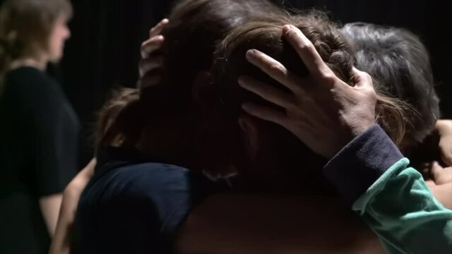dancer gently hug each other after dance