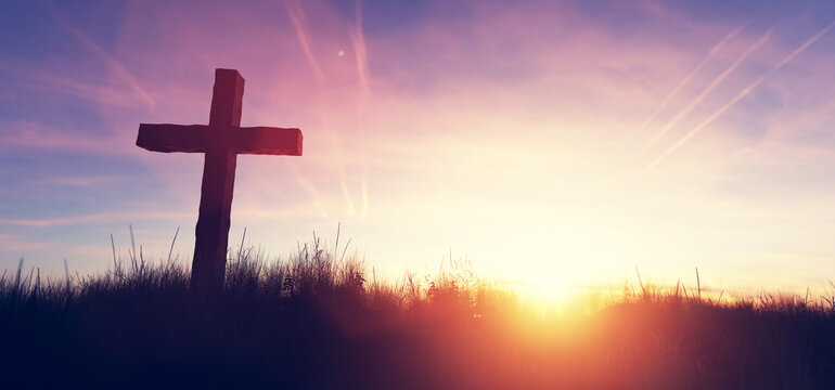 Cross at sunset religion and faith