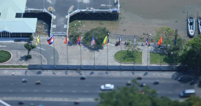 Miniature national flags of ASEAN countries on the city street in Ho Chi Minh tiltshift