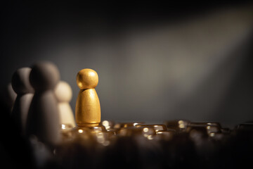 Success in Business or Talent Concept. Stand Out from the Crowd. Different and Individual Unique Person. Spotlight Shining to the Golden. presenting by wooden peg dolls