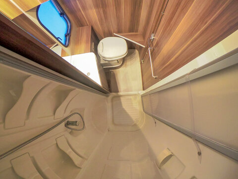 interior of a mobile home. Motorhome inside. interior of a mobile home. Motorhome inside. Toilet and shower. Restroom, shower cabin