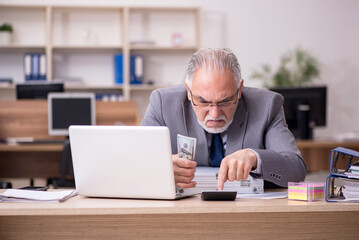 Fototapeta premium Old male employee in remuneration concept