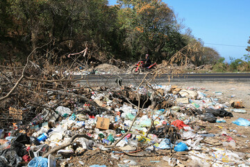 Garbage dump alongside Road 200 to Acapulco, near Puerto Vicente Guerrero (Guerrero State).