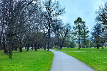 Old city park in overcast weather at the evening time.