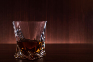 A glass of whiskey on the table