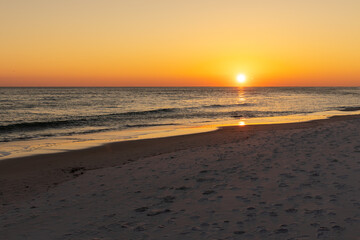 Beach sunset with a cloudless sky