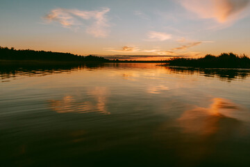 Sunset over the Lielupe river in Latvia during warm summer evening