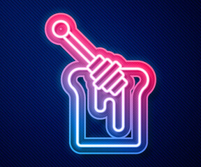 Glowing neon line Honey dipper stick with dripping honey icon isolated on blue background. Honey ladle. Vector