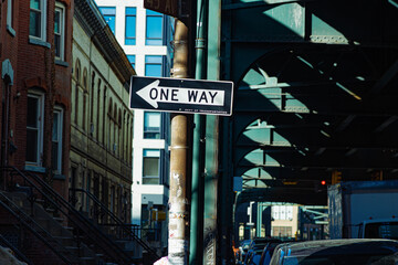 One way sign in NYC on classic building background
