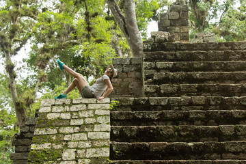 Woman Sitting At The Edge Of Pyramid