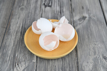 Shells of three raw eggs, broken for an omelet